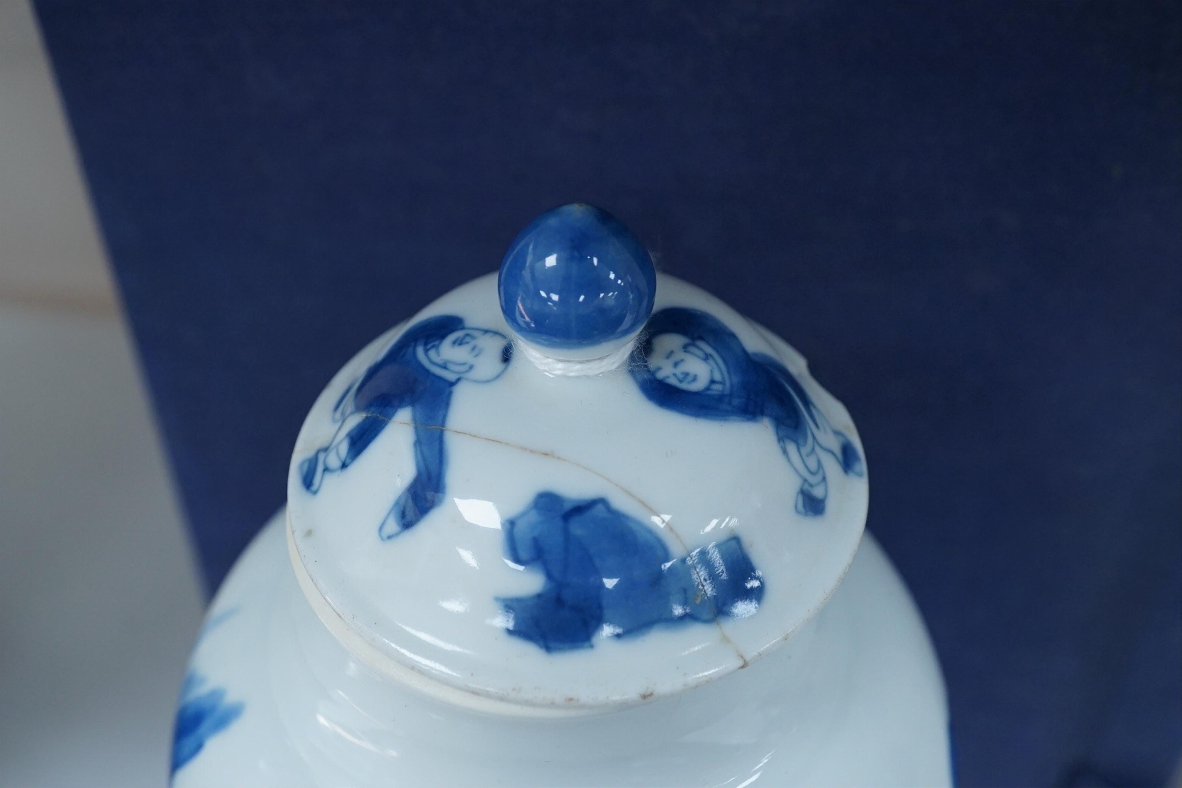 A Chinese blue and white baluster vase, early Kangxi, and associated cover